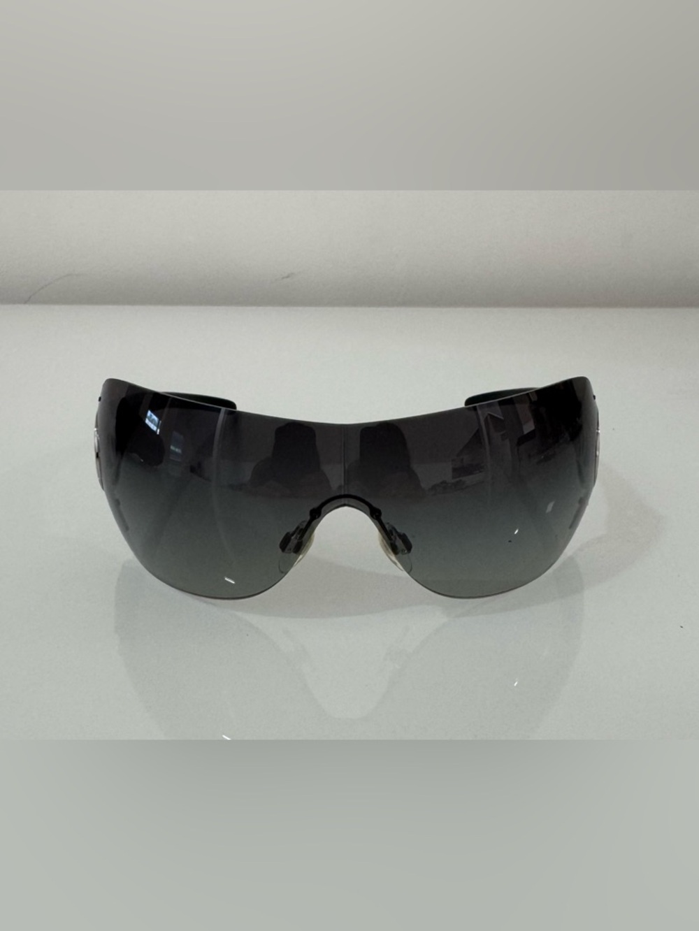 CHANEL Black and Silver Rimless Shield Sunglasses with Smoke Gradient Lens